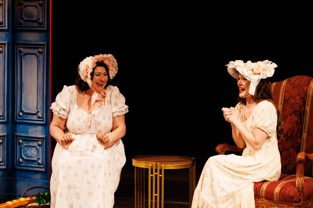 Meg Page (Yana White, at left) and Alice Ford (Hadassah Misner) laugh together in the "Letter Duet" from Verdi's "Falstaff."