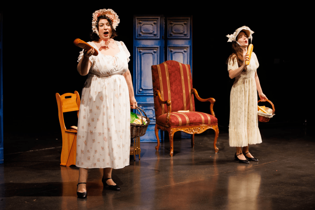 Meg Page (Yana White, at left) and Alice Ford (Hadassah Misner) plan their revenge, in the "Letter Scene" from Verdi's "Falstaff."