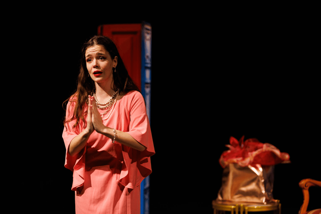 Josephine (Hadassah Misner) tries to decide, in "A simple sailor, lowly born" from Gilbert and Sullivan's "H.M.S. Pinafore".